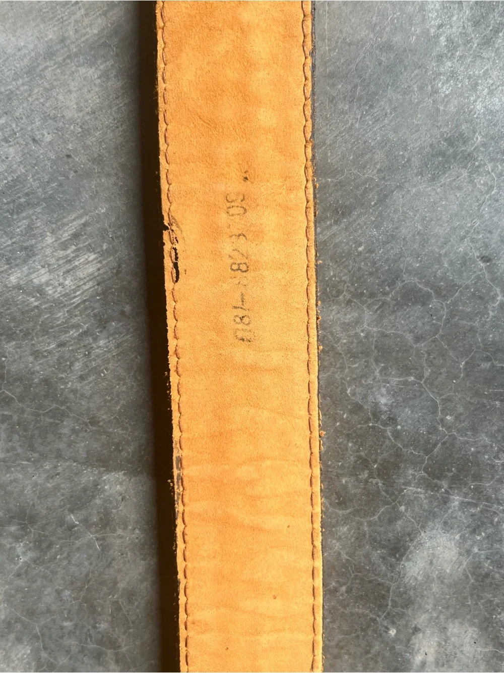 Vintage Levi's black tooled leather western belt with rotating harness buckle